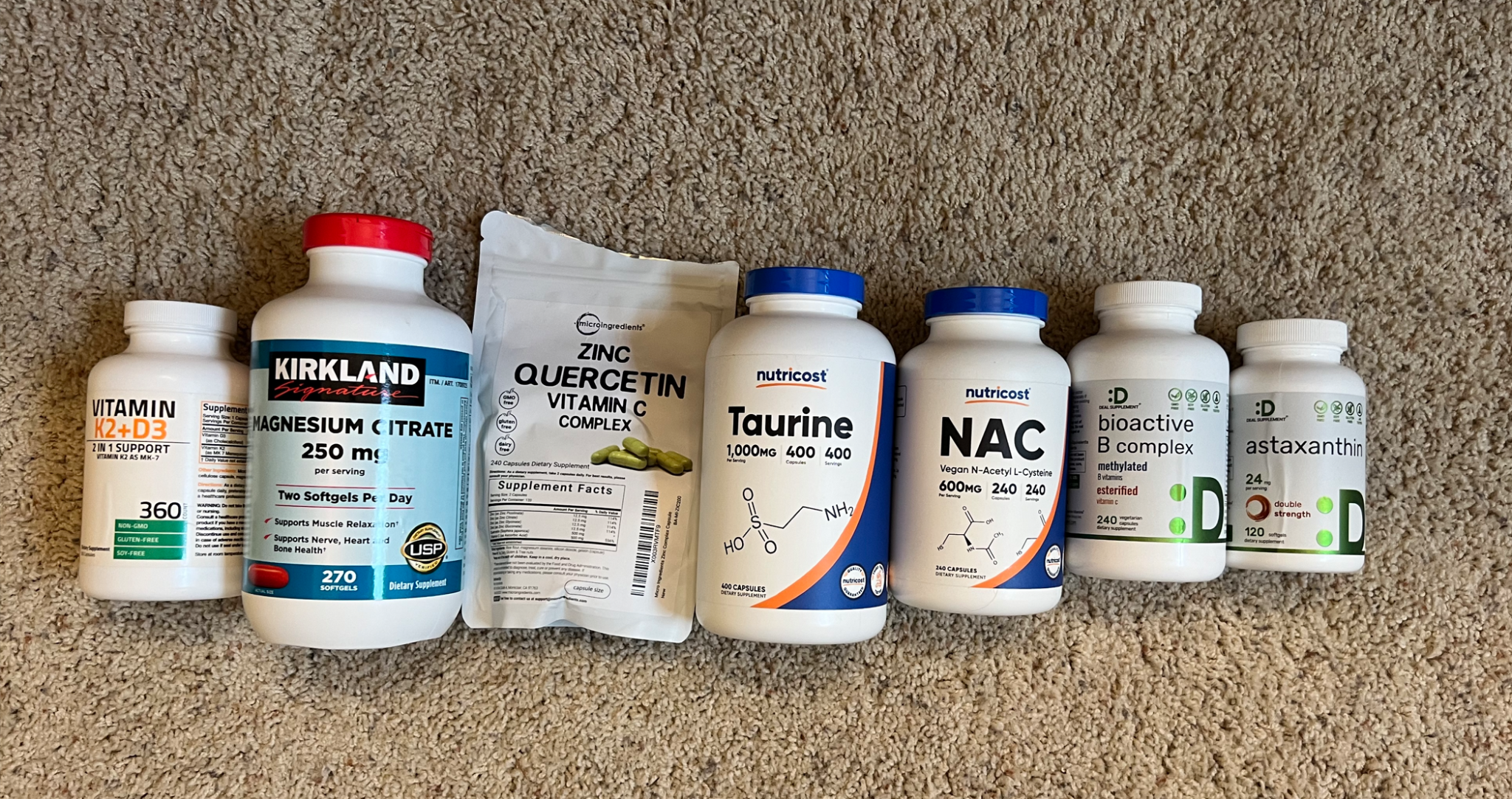 A picture of VitimanD+K, Magnesium Citrate, Zinc, Taurine, NAC, B complex and Astaxanthin containers.