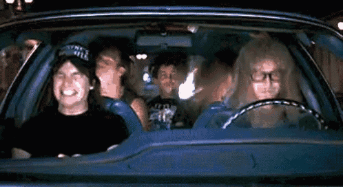 GIF of the Wayne's World Guys headbanging to Freddie Mercury