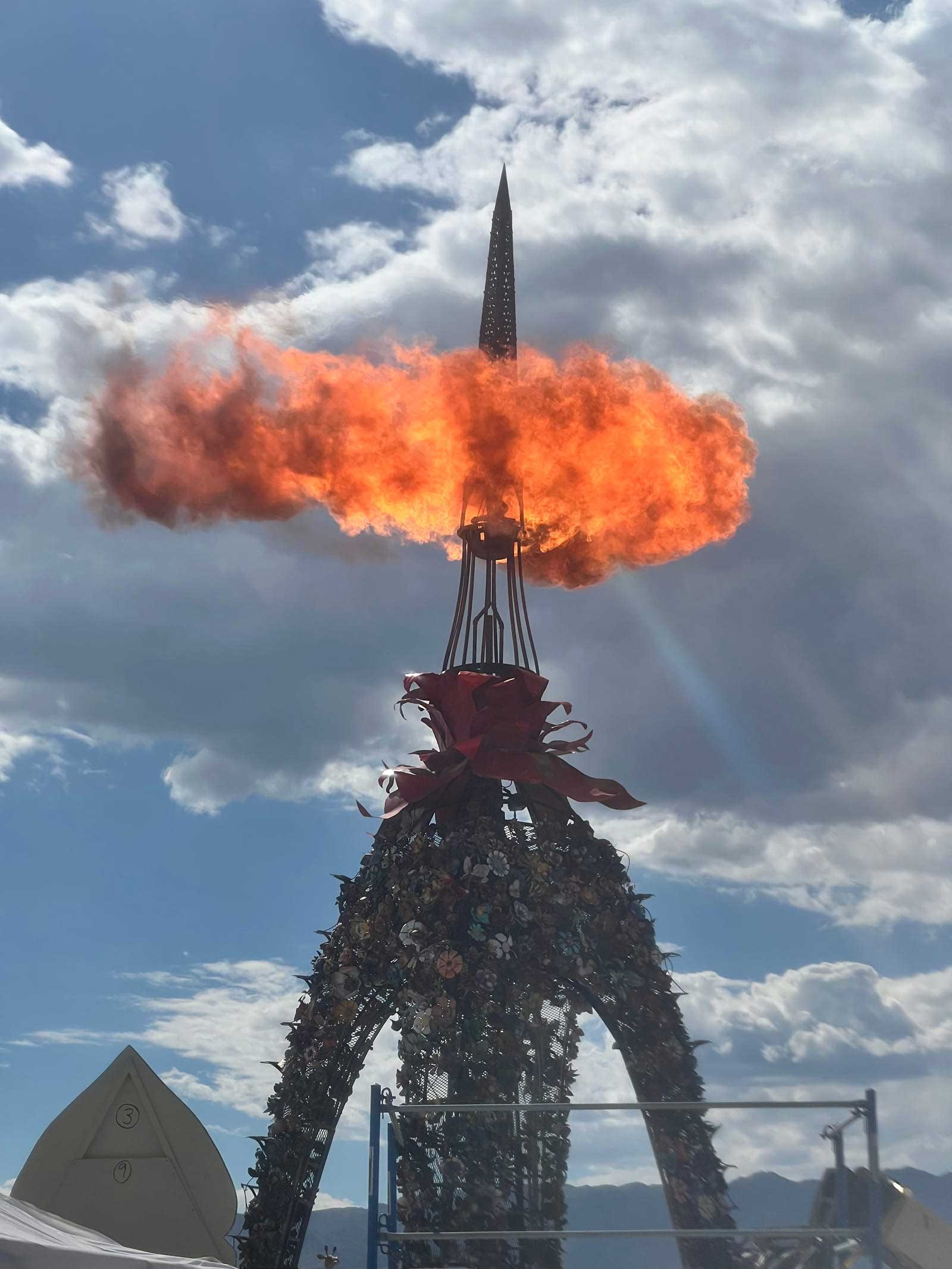 The Flower Bar flame effect at Burning Man — a section of the 2017 Flower Tower mounted on Weird Steel’s bar, spitting fire into the night.