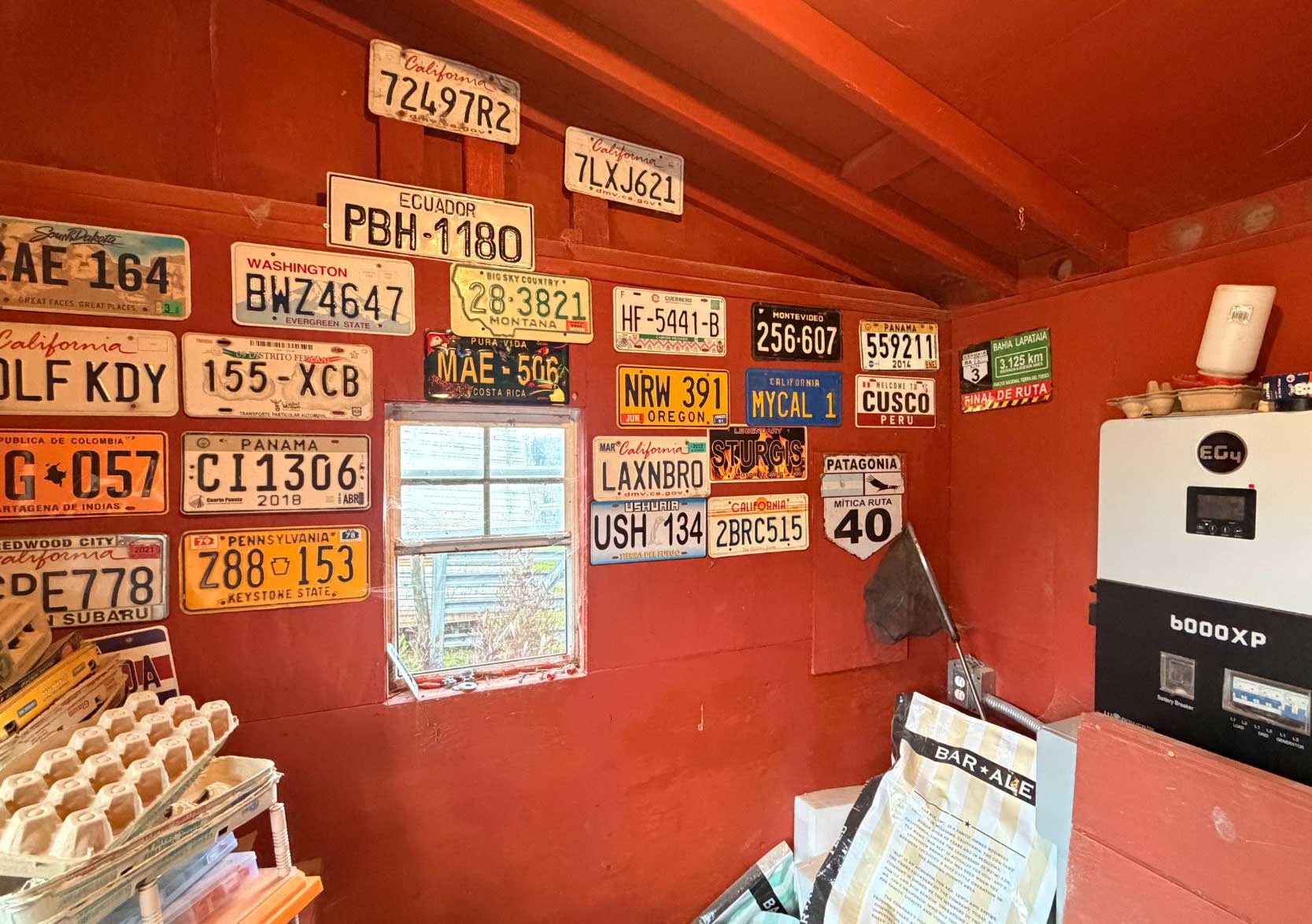 ChickenCoop Wall with license plates including the famous California LAXNBRO Plate